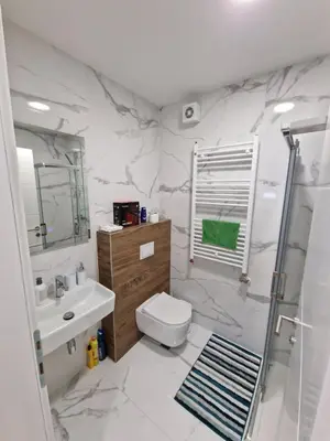 a bathroom with a toilet and a sink and a shower at Apartment 4th. Floor II in Banja Luka
