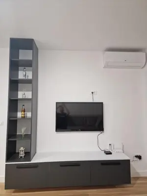 a living room with a tv on a white wall at Apartment 4th. Floor II in Banja Luka