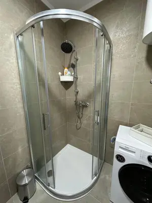 a shower with a glass enclosure in a bathroom at Apartman Besta in Banja Luka