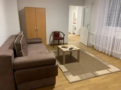 a living room with a couch and a coffee table at Darija's place in Banja Luka