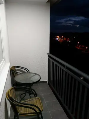 a balcony with two chairs and a table and a window at HG3 Jelah Stan na Dan in Jelah