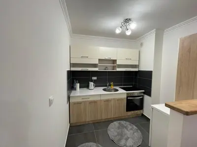 a kitchen with white cabinets and a sink at HG3 Jelah Stan na Dan in Jelah