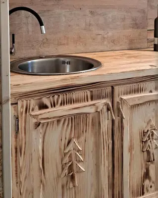 a wooden cabinet with a sink in a bathroom at Apartman Maximus in Kupres