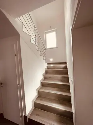 a staircase in a house with a window at Kuca za odmor Nedo in Kupres
