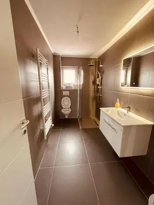 a bathroom with a toilet and a sink at Kuca za odmor Nedo in Kupres