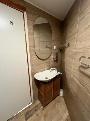 a bathroom with a sink and a mirror at Vila Dvorište in Banja Luka