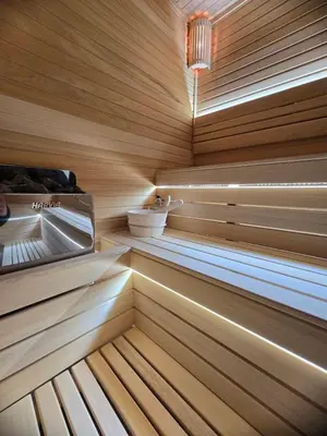 a wooden sauna with wooden floors and a ceiling at Romantic Lodge in Banja Luka
