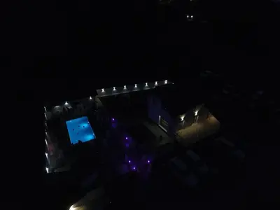 an overhead view of a building at night with lights at Romantic Lodge in Banja Luka