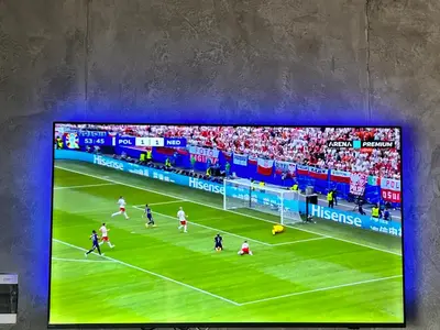 a picture of a soccer game on a tv screen at Romantic Lodge in Banja Luka