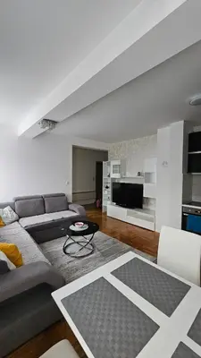 a living room with a couch and a table at Apartman Dolores in Banja Luka