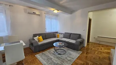 a living room with a couch and a table at Apartman Dolores in Banja Luka