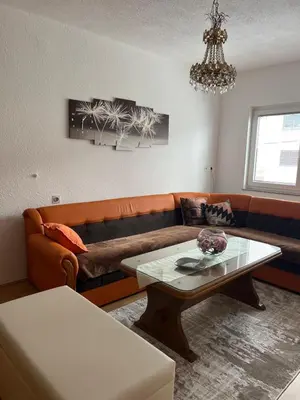 a living room with a couch and a table at Apartman Lara in Kupres