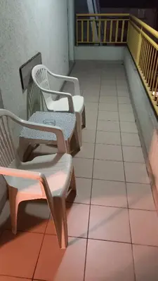 two chairs sitting on top of a balcony at Apartman Lena Doboj in Doboj