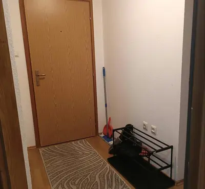 a room with a broom next to a door at Apartman Iva in Kupres