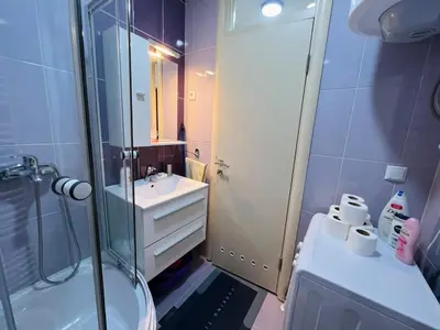 a bathroom with a shower and a sink and a toilet at Apartman Stefan in Banja Luka
