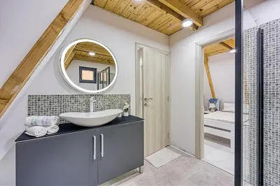 a bathroom with a sink and a mirror at UNA RESORT in Bosanska Krupa