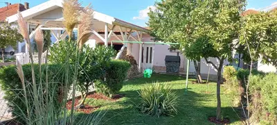 a house with a green object in the yard at Holiday Home Peaceful Retreat in Visoko