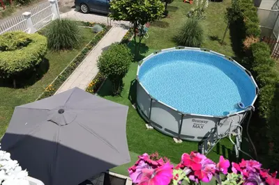 an overhead view of a swimming pool and an umbrella at Holiday Home Peaceful Retreat in Visoko