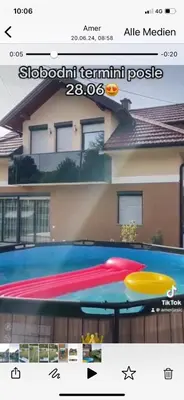 a picture of a swimming pool in front of a building at Vila BD in Milešići