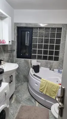 a bathroom with a tub and a sink and a toilet at Bosnien Old House in Travnik