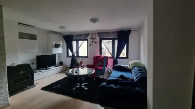 a living room with a couch and a table at Bosnien Old House in Travnik