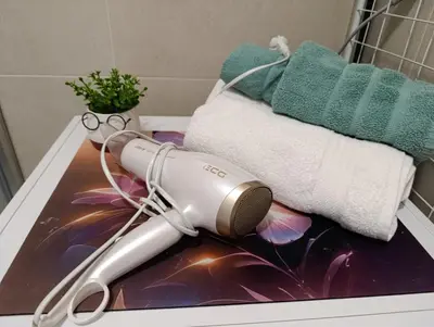 a blow dryer sitting on top of a bathroom sink at Apartman Bjanka in Banja Luka