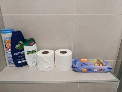 two rolls of toilet paper on a shelf in a bathroom at Apartman Bjanka in Banja Luka