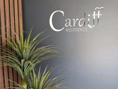 a sign for an event with a plant at Apartman Bjanka in Banja Luka