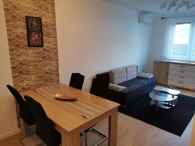 a living room with a table and a couch at Apartment Banja Luka in Banja Luka