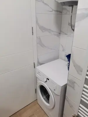 a laundry room with a washer and dryer at Apartment Banja Luka in Banja Luka