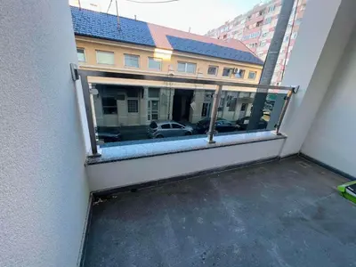 a balcony with a view of a parking lot at Apartman Maja Lux in Banja Luka