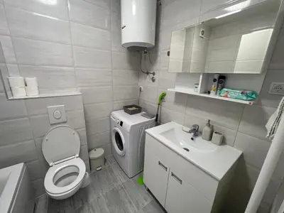 a small bathroom with a toilet and a sink at Apartman Maja Lux in Banja Luka