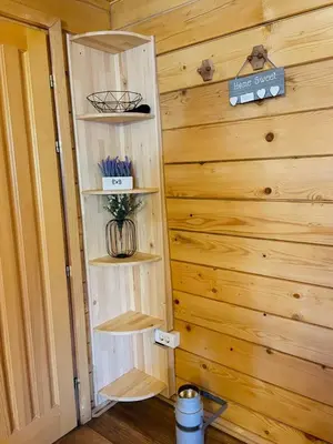 a wooden wall with shelves in a room at Vikendica Bajka in Banja Luka