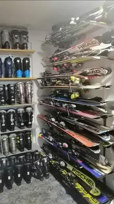 a shelf filled with lots of different types of ski equipment at Vikendica Striček in Kupres