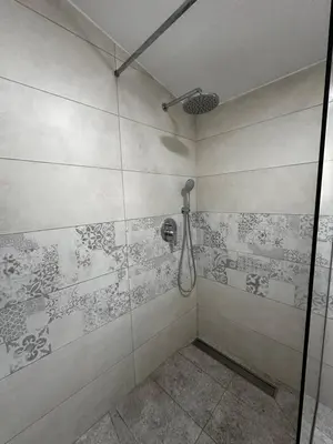 a bathroom with a shower with a glass door at Villa Ruža Vareš in Vareš