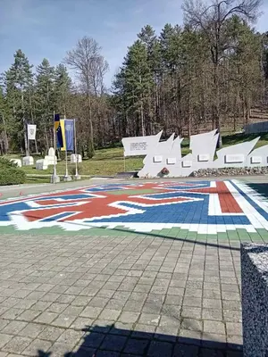 a large mural on the ground in a park at AS apartman Panonica in Tuzla