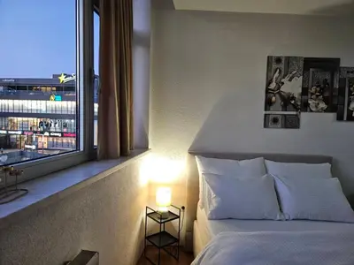 a bedroom with a bed and a large window at Mrakovica 1 in Prijedor