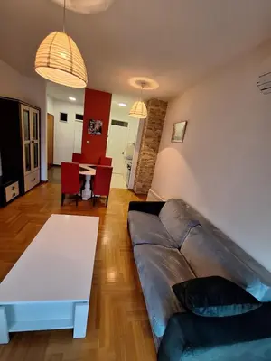a living room with a couch and a table at San apartment in Banja Luka