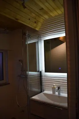 a bathroom with a sink and a mirror at Villa Šola in Kupres