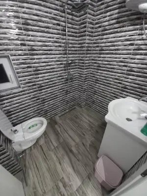 a bathroom with a toilet and a sink at Apartman Varcar in Bihać