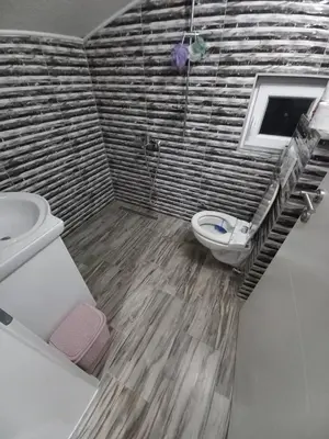 a bathroom with a toilet and a sink at Apartman Varcar in Bihać