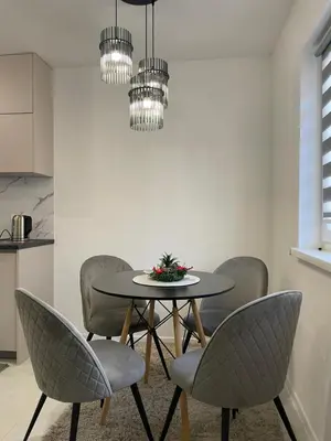 a dining room with a table and chairs at Apartman Marina stan na dan in Prijedor