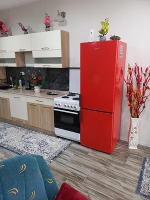 a kitchen with a red refrigerator and a stove at Apartman Varcar in Bihać