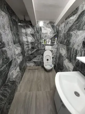 a bathroom with a toilet and a sink at Apartman Varcar in Bihać