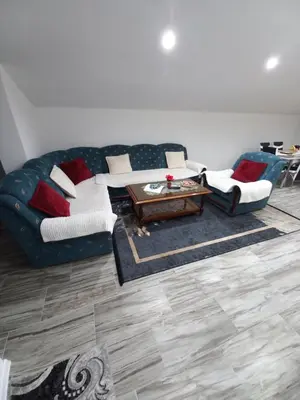 a living room with a couch and a table at Apartman Varcar in Bihać
