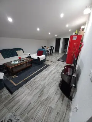 a living room with a couch and a table at Apartman Varcar in Bihać