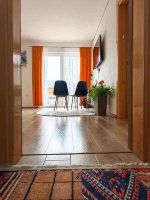 a living room with two chairs and a mirror at Villa Pliva Lake in Jajce