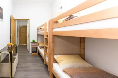 a hallway with two bunk beds in a room at Kingdom Rooms Visoko in Visoko