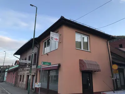 a building on the side of a street at Kingdom Rooms Visoko in Visoko