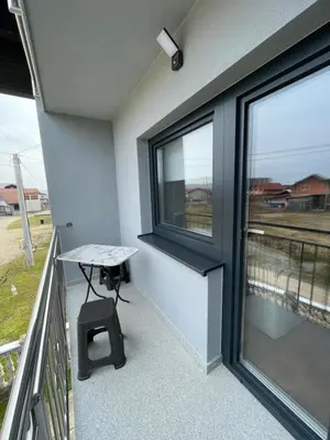 a balcony with a table and a window and a table at Bijeli Cvijet in Glamočani